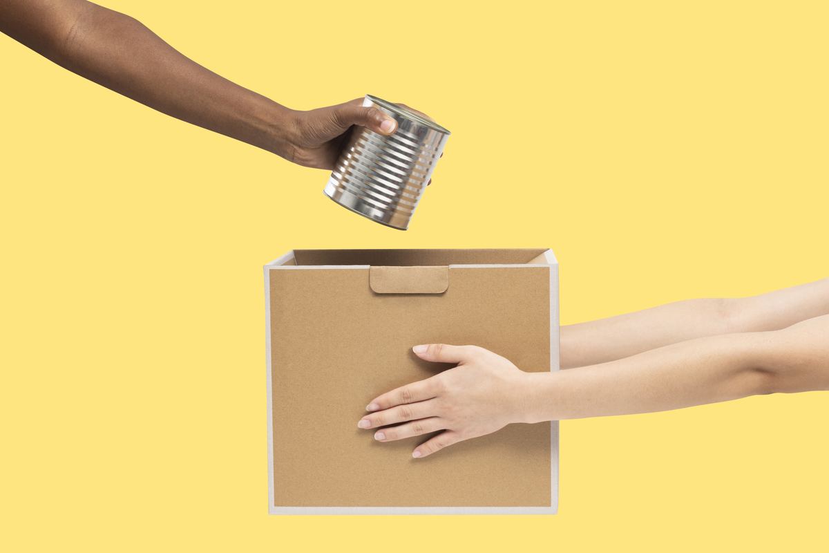 neighbors dropping off cans at a community thanksgiving food drive