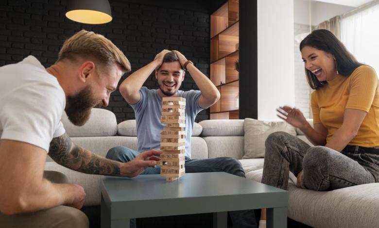 friends laughing together at a friendsgiving party