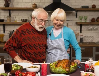 older adults sharing a thanksgiving meal together